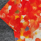 SpringStil® - Orangefarbenes Top mit Rundhalsausschnitt