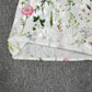 SpringStil® - Garden Print V-Ausschnitt Weißes Maxi-Sommerkleid