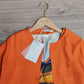FallStil® - Orangefarbenes Midikleid mit halben Ärmeln und V-Ausschnitt