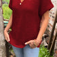 Stricktop mit Knopfdetail und V-Ausschnitt