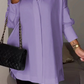 Elegante Oversize-Hemdbluse mit Rollärmeln