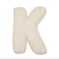 Das flauschige Boucle-Buchstaben-Kissen